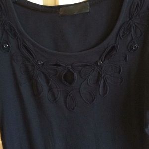 Woolworth black top with cut out accents. Size M